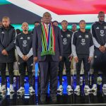 Cyril Ramaphosa with Bafana behind him