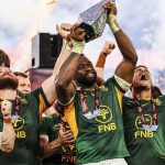Siya Kolisi holding Rugby's Greatest Rivalry